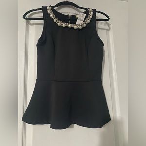 Black peplum top with beading neckline